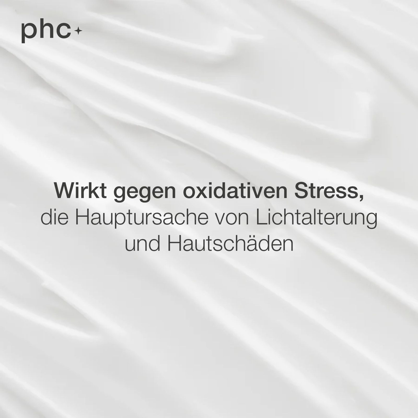 Weißer Stoff mit Text: Wirkt gegen oxidativen Stress, die Hauptursache von Lichtalterung und Hautschäden. Logo: phc+.