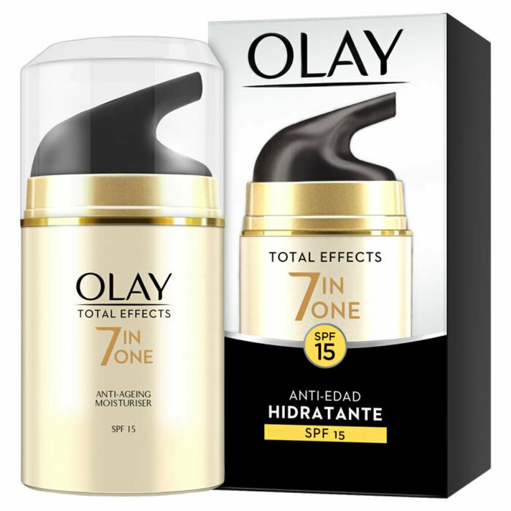 Creme-Spender mit Verpackung. Olay Total Effects 7 in One, Anti-Ageing Moisturiser, SPF 15. Goldfarbener Spender, schwarzer Deckel, weiße Schrift.