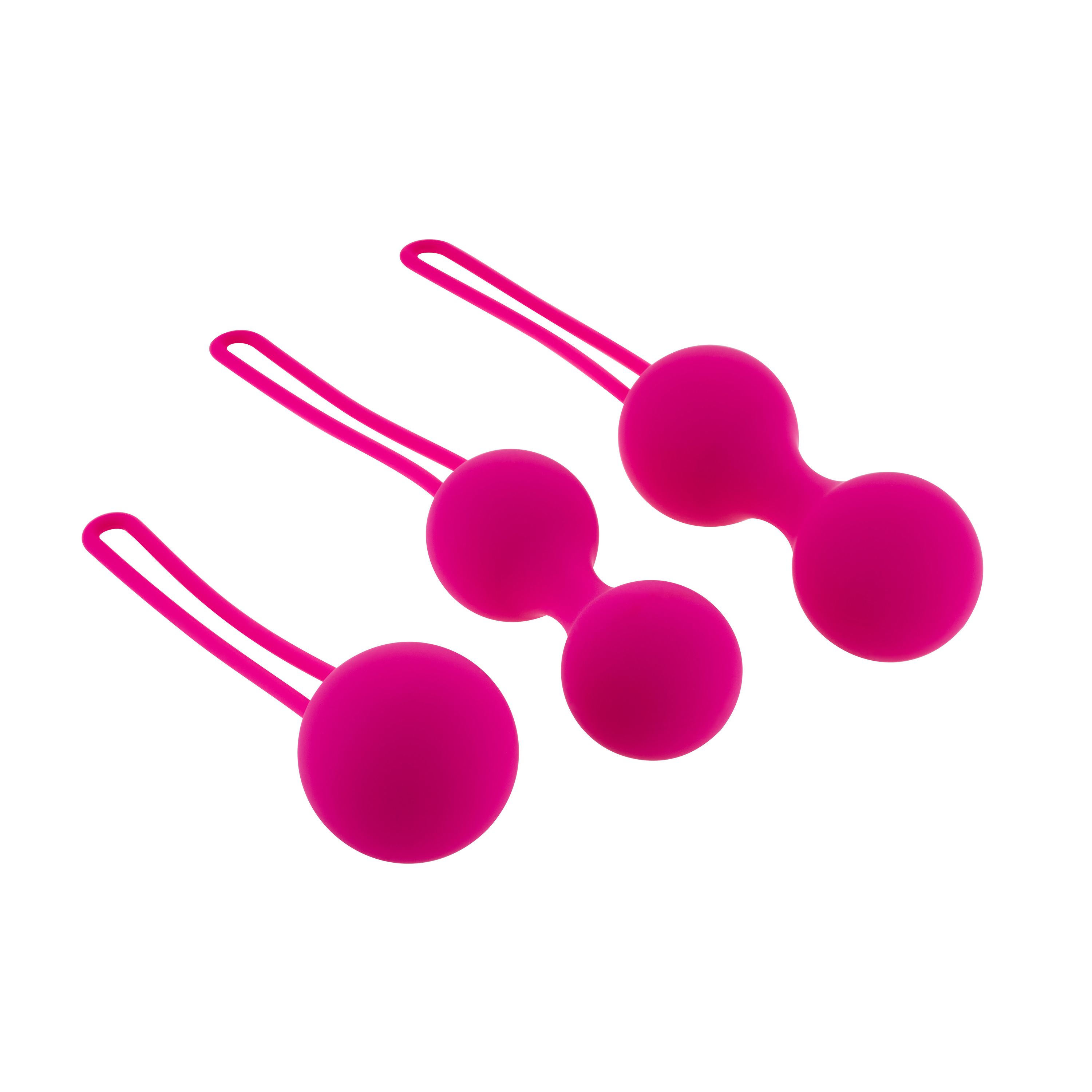 Drei pinkfarbene Kugeln mit Schlaufen. Unterschiedliche Größen.