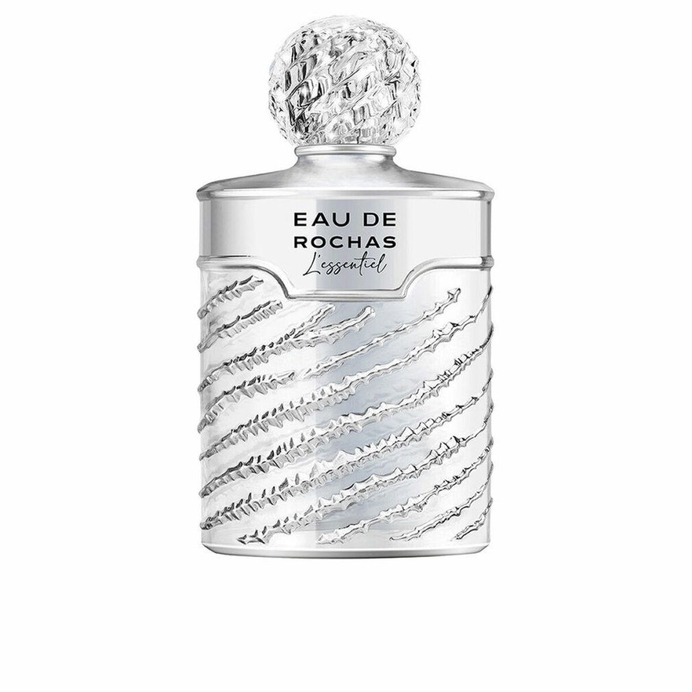 Silberfarbener Flakon mit geriffelter Oberfläche und Kappe. Aufschrift: Eau de Rochas L'Essentiel.
