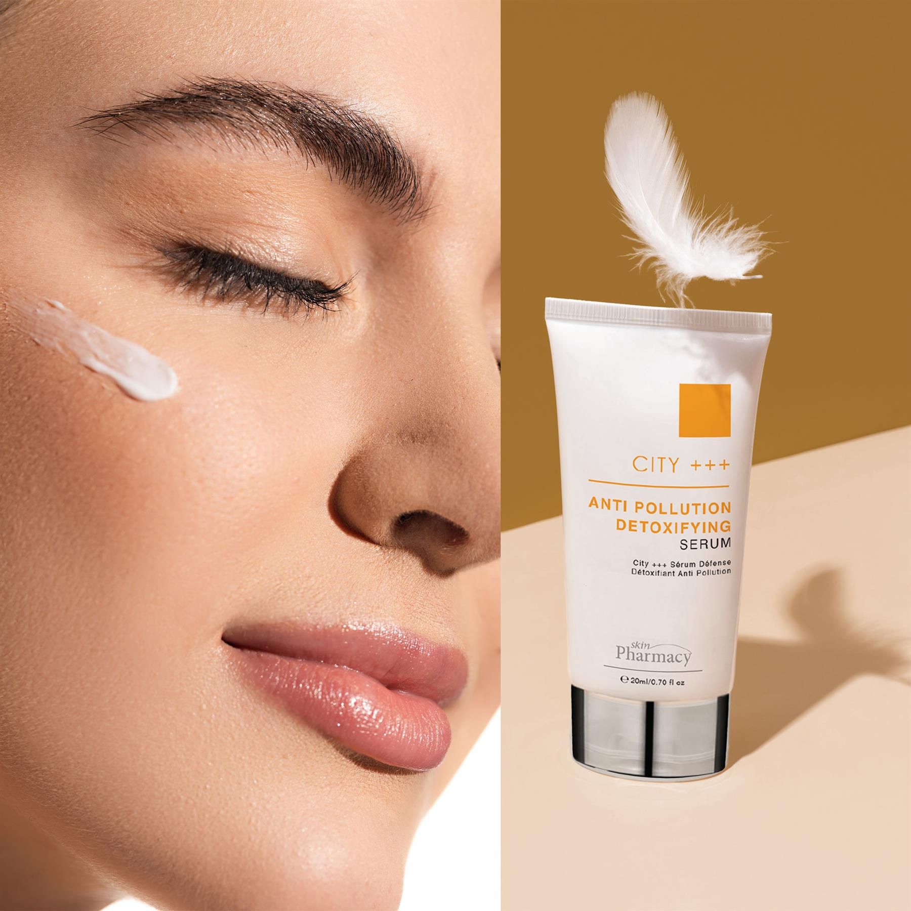 Frau mit Hautpflegeprodukt auf der Wange, daneben Tube skinPharmacy City +++ Serum.