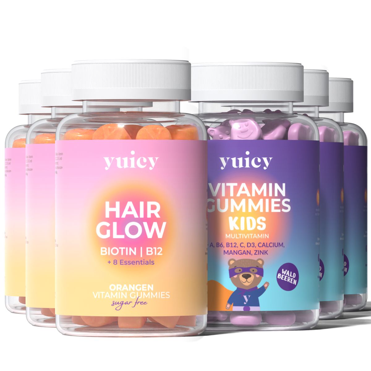 Mehrere Flaschen mit Vitamin-Gummis. Aufschrift: yuicy Hair Glow und Vitamin Gummies Kids. Verschiedene Farben und Etiketten.