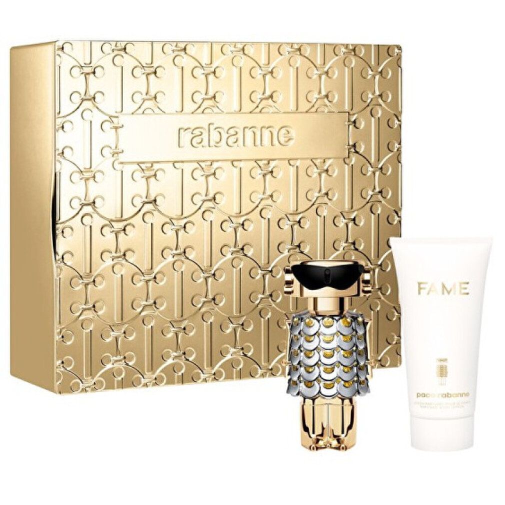 Geschenkset mit goldfarbener Dose, Parfümflakon und Tube. Dose mit Prägung und Schriftzug rabanne. Flakon in Roboterform.