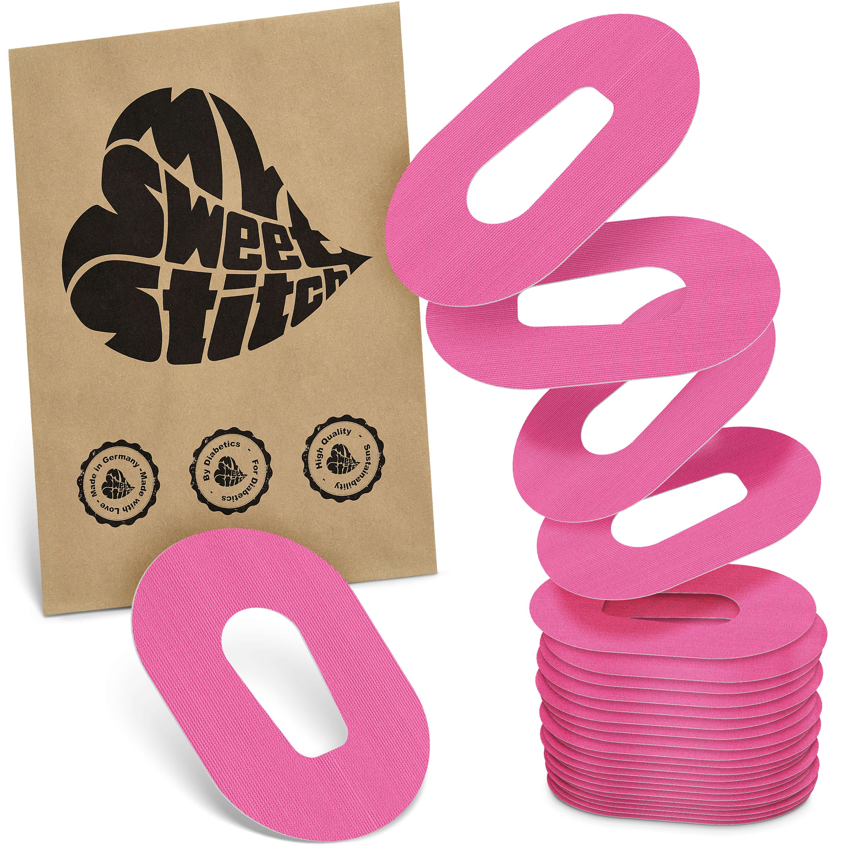 Rosa Fixierpflaster, ovales Design mit Aussparung. Braune Verpackung mit Logo und Siegeln. Stapel und einzelne Pflaster.