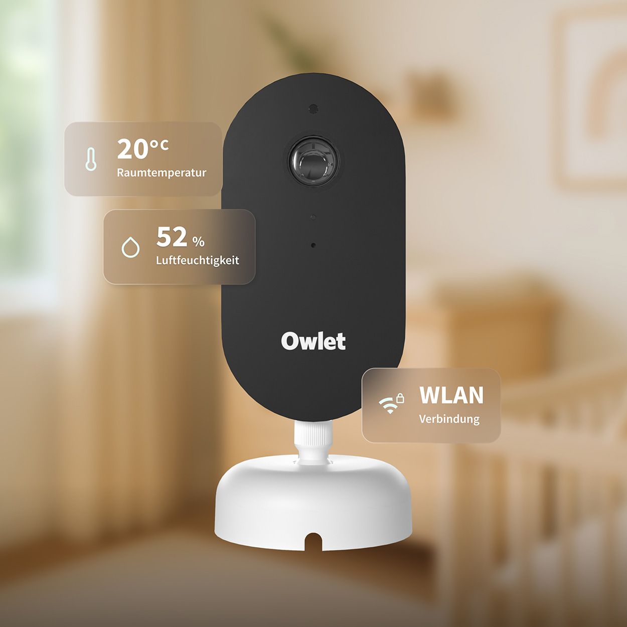 Schwarze Babyphone-Kamera mit weißer Basis. Temperatur-, Feuchtigkeits- und WLAN-Anzeigen. Owlet-Logo.