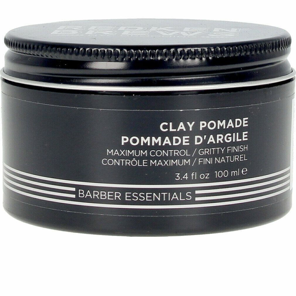 Schwarze Dose mit Deckel. Aufschrift: Clay Pomade, Pommade d'Argile, Barber Essentials. 3.4 fl oz 100 ml.