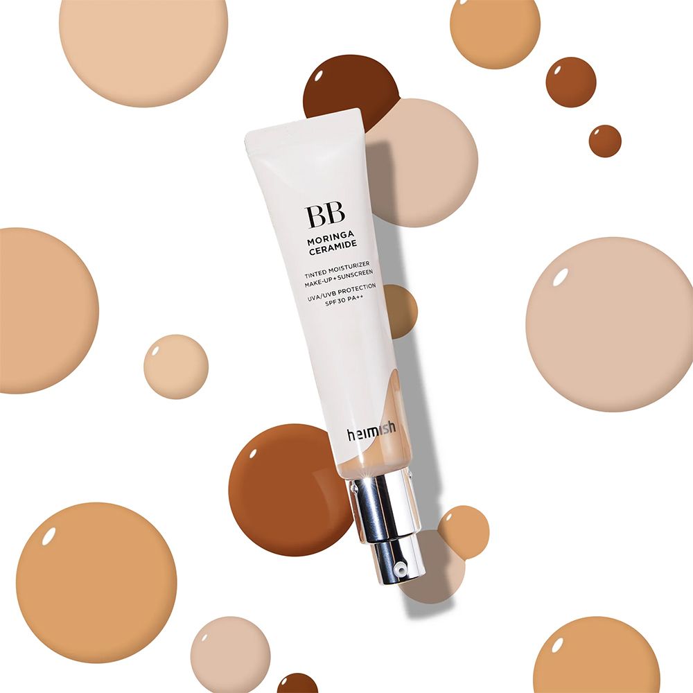 BB Moringa Ceramide BB-Creme umgeben von Farbtropfen in verschiedenen Hauttönen.
