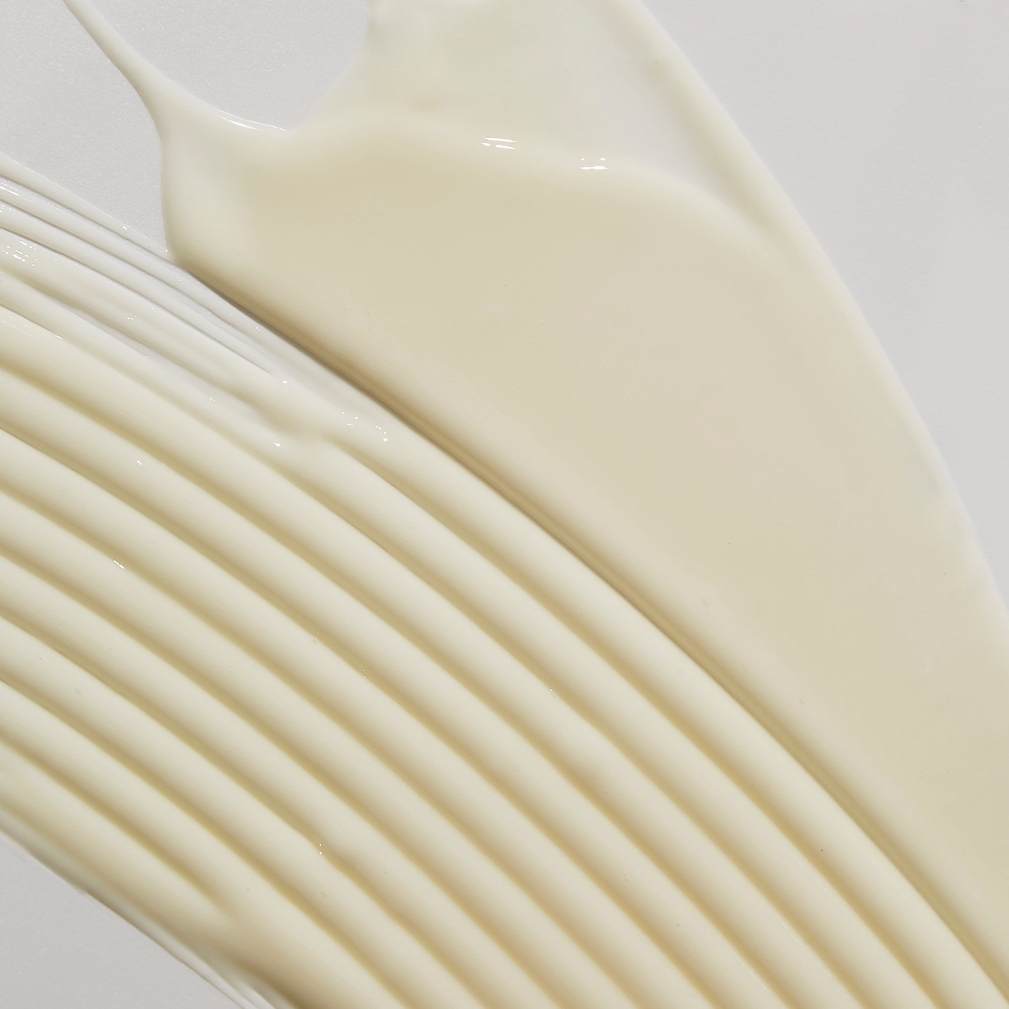 Nahaufnahme von Serum. Cremige Textur mit Streifen.