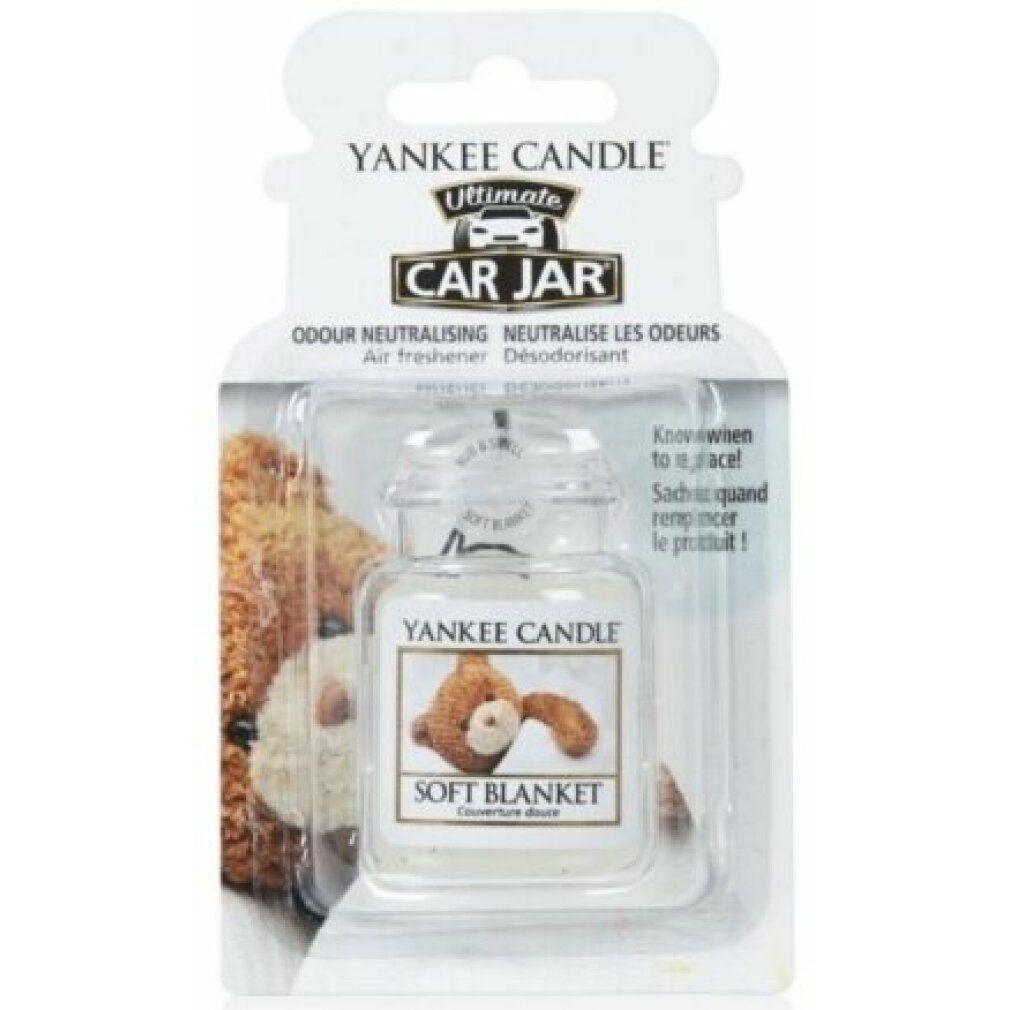 Lufterfrischer im Glasbehälter mit Deckel, in Blisterverpackung. Aufschrift: Soft Blanket. Marke: Yankee Candle.