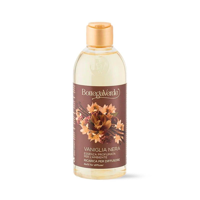 Ricarica essenza profumata per ambiente Bottega Verde Vaniglia Nera. Flacone trasparente con tappo dorato ed etichetta marrone con design floreale e nome del prodotto. Il testo include "Essenza profumata per l'ambiente" e "Ricarica per diffusore".