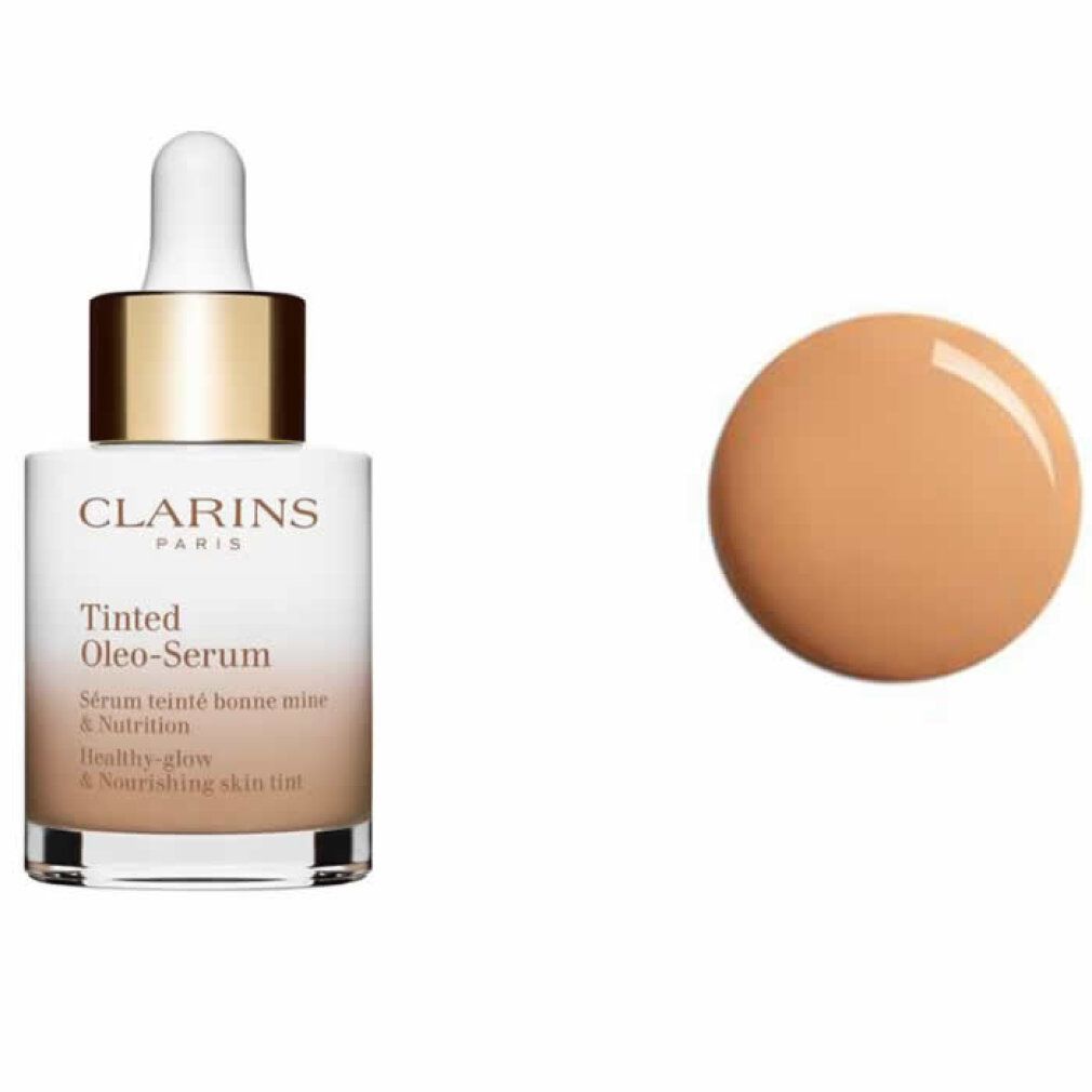 Flakon mit Pipette und getönter Flüssigkeit. Aufschrift: Clarins Paris, Tinted Oleo-Serum. Farbklecks.