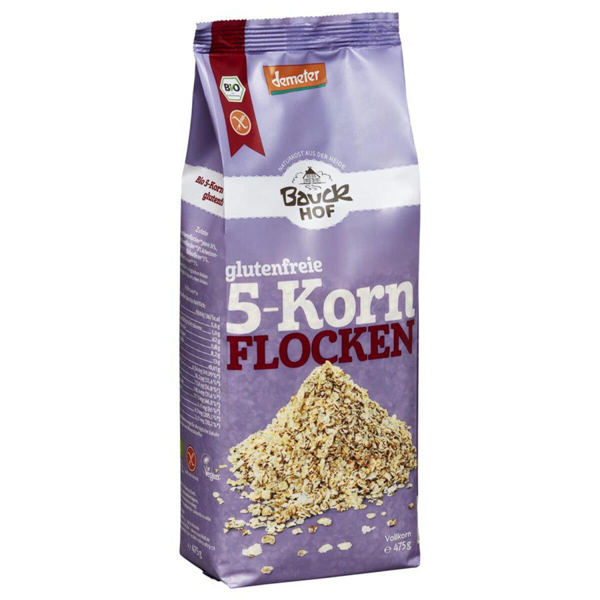 Violette Verpackung mit Aufschrift "Bauckhof glutenfreie 5-Korn Flocken". Demeter-Siegel. Geöffnete Packung mit Flocken.