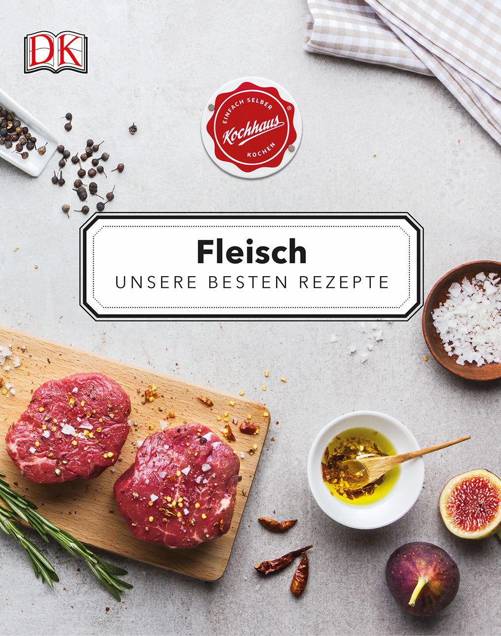 Kochbuch "Fleisch". Auf einem Holzbrett liegen zwei rohe Fleischstücke. Daneben Gewürze, Öl, Feigen und Rosmarin.