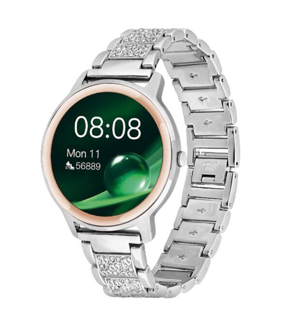 Silberfarbene Smartwatch mit rundem Zifferblatt. Das Display zeigt Uhrzeit und Datum. Armband mit Strasssteinen.