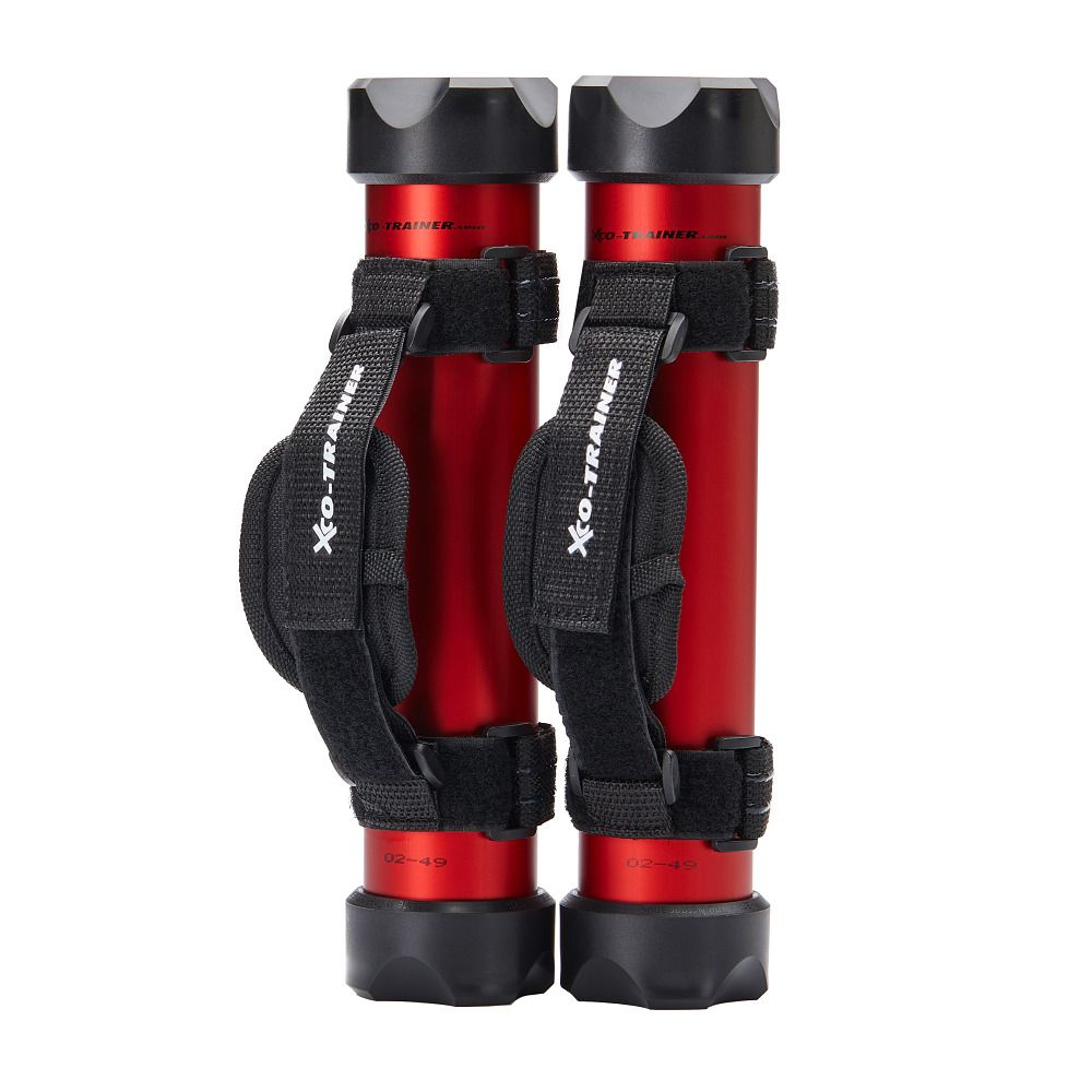 Zwei rote Hanteln mit schwarzen Enden und Griffen. Schwarze Klettbänder mit Logo. Hanteln stehen nebeneinander.