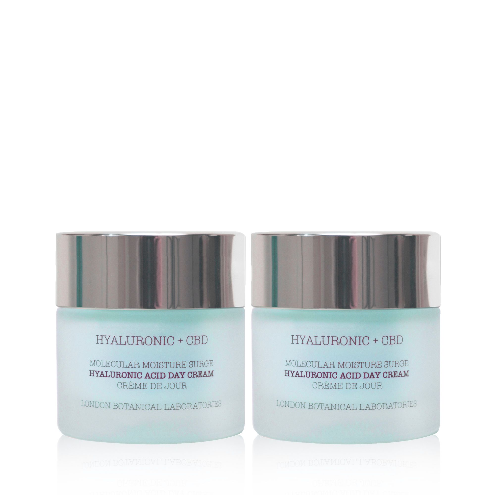 Zwei Tiegel Tagescreme mit silbernen Deckeln. Aufschrift: Hyaluronsäure + CBD, Molecular Moisture Surge, Crème de Jour. London Botanical Laboratories.