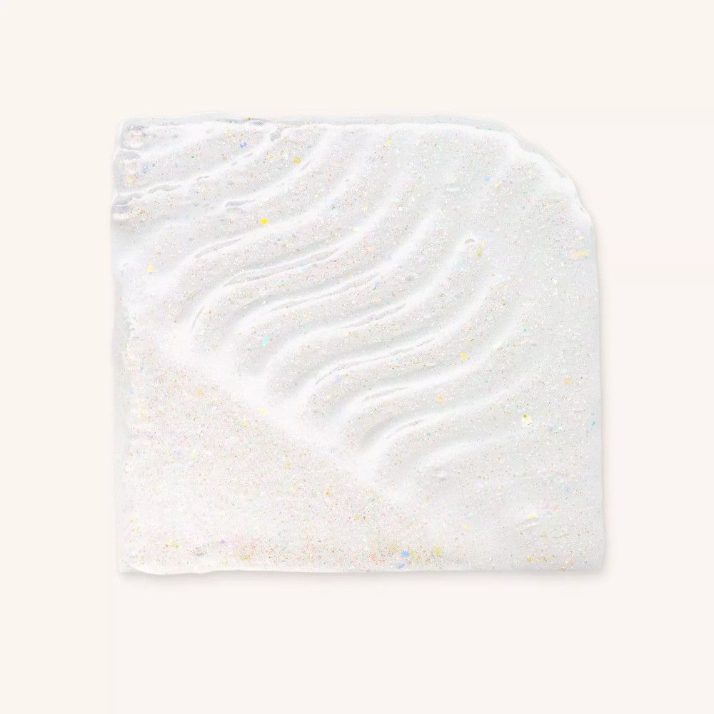 Texturprobe von schimmerndem, getöntem Lippenöl mit Wellenmuster.