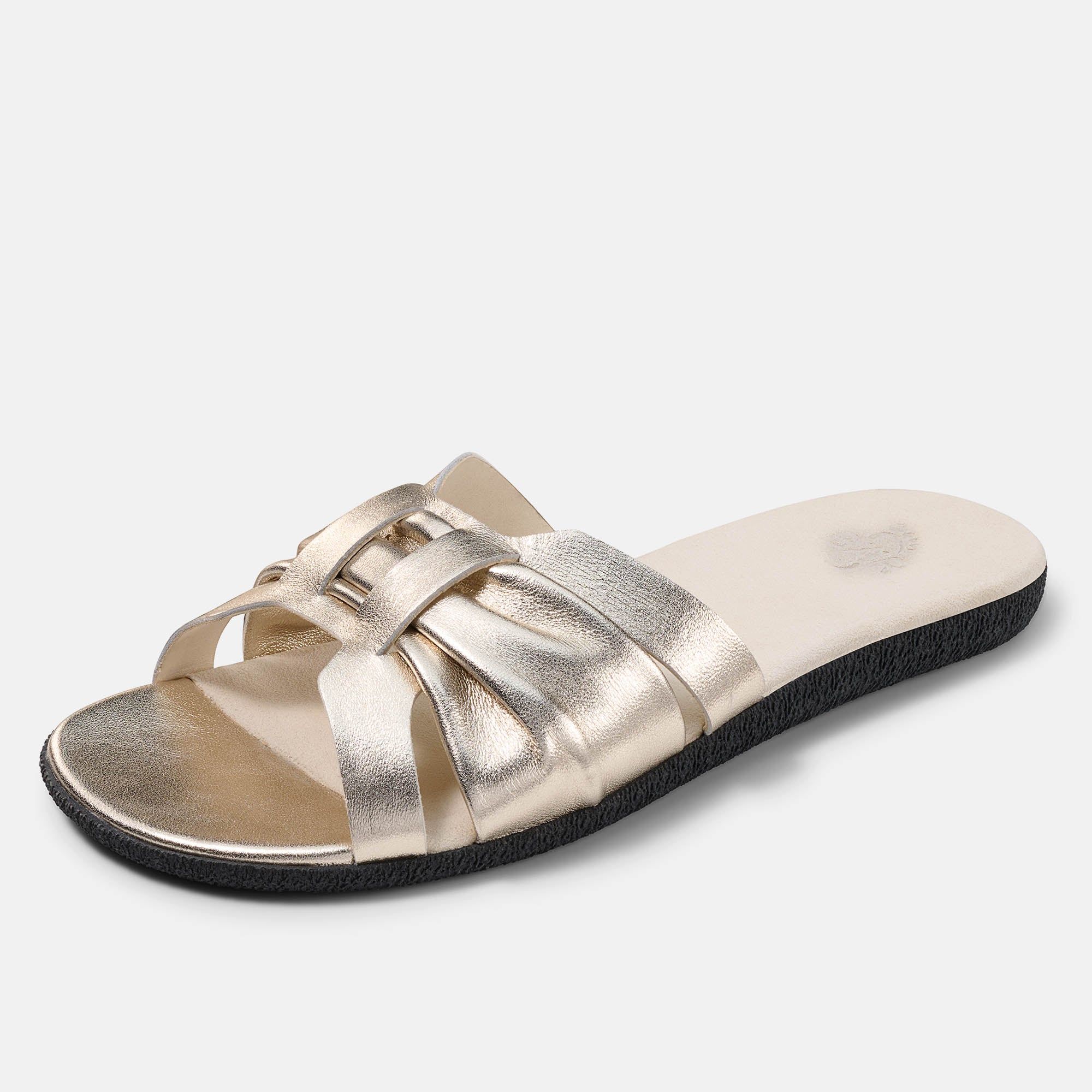 Goldene Damen-Pantolette mit gekreuzten Riemen, von der Seite.