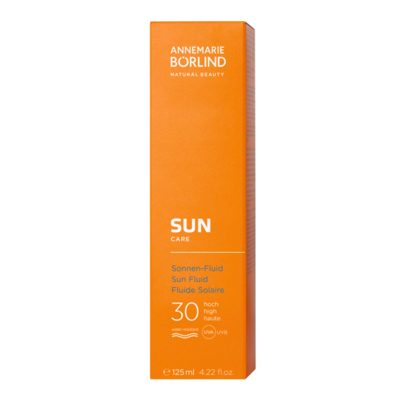 Orangefarbene Verpackung. Text: ANNEMARIE BÖRLIND, SUN CARE, Sonnen-Fluid LSF 30. Mit Logos.