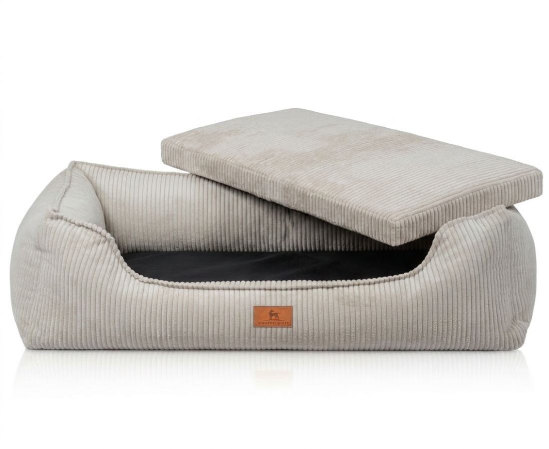 Graues Hundebett mit abnehmbarem Kissen. Innen schwarz, außen Cord-Stoff.
