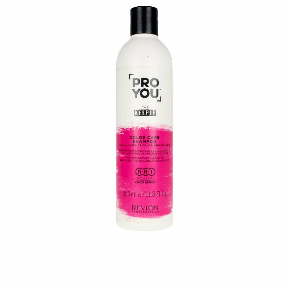 Weiße Flasche mit schwarzem Deckel. Aufschrift: PRO YOU THE KEEPER COLOR CARE SHAMPOO. Rosa Farbband. 350ml/11.8 FL.OZ. REVON PROFESSIONAL.