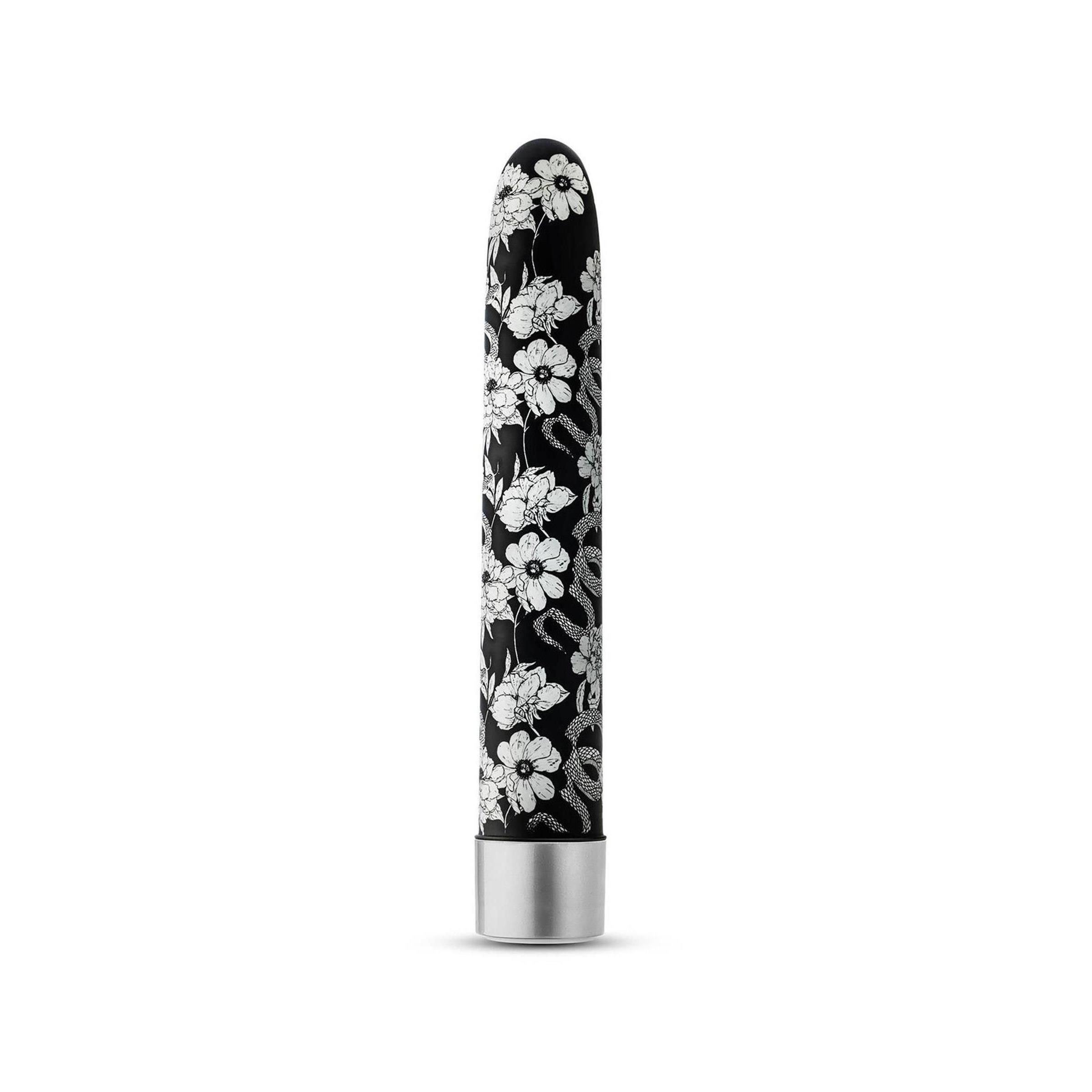 Wellness-Produkt mit Blumenmuster. Schwarzer Hintergrund, silberfarbener Abschluss. Vertikale Ausrichtung.