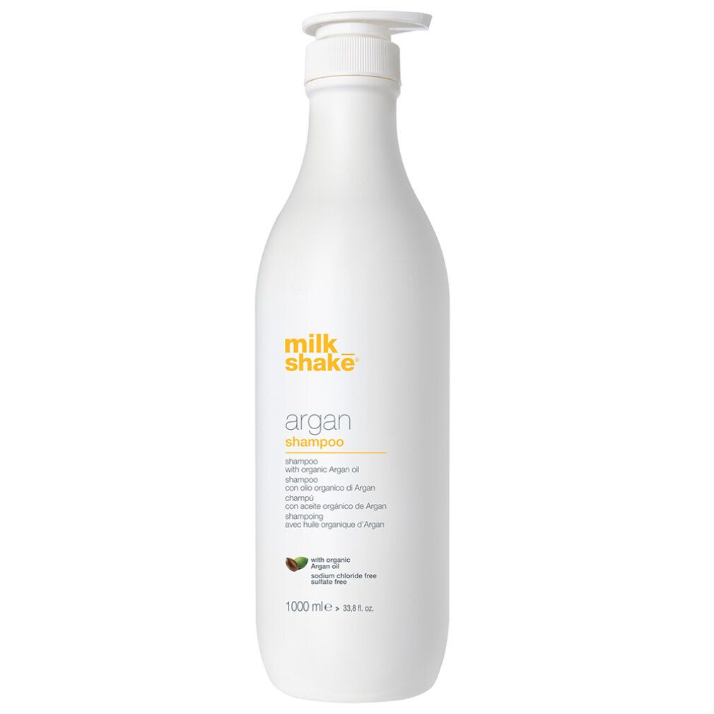 Weiße Flasche mit gelbem Etikett. Aufschrift: Milk_shake argan shampoo. Mit Arganöl. 1000 ml.