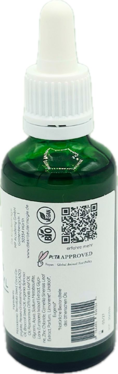 Grüne Glasflasche mit weißem Etikett. Aufschrift: "PETA APPROVED". Mit Pipette. QR-Code und Logos.