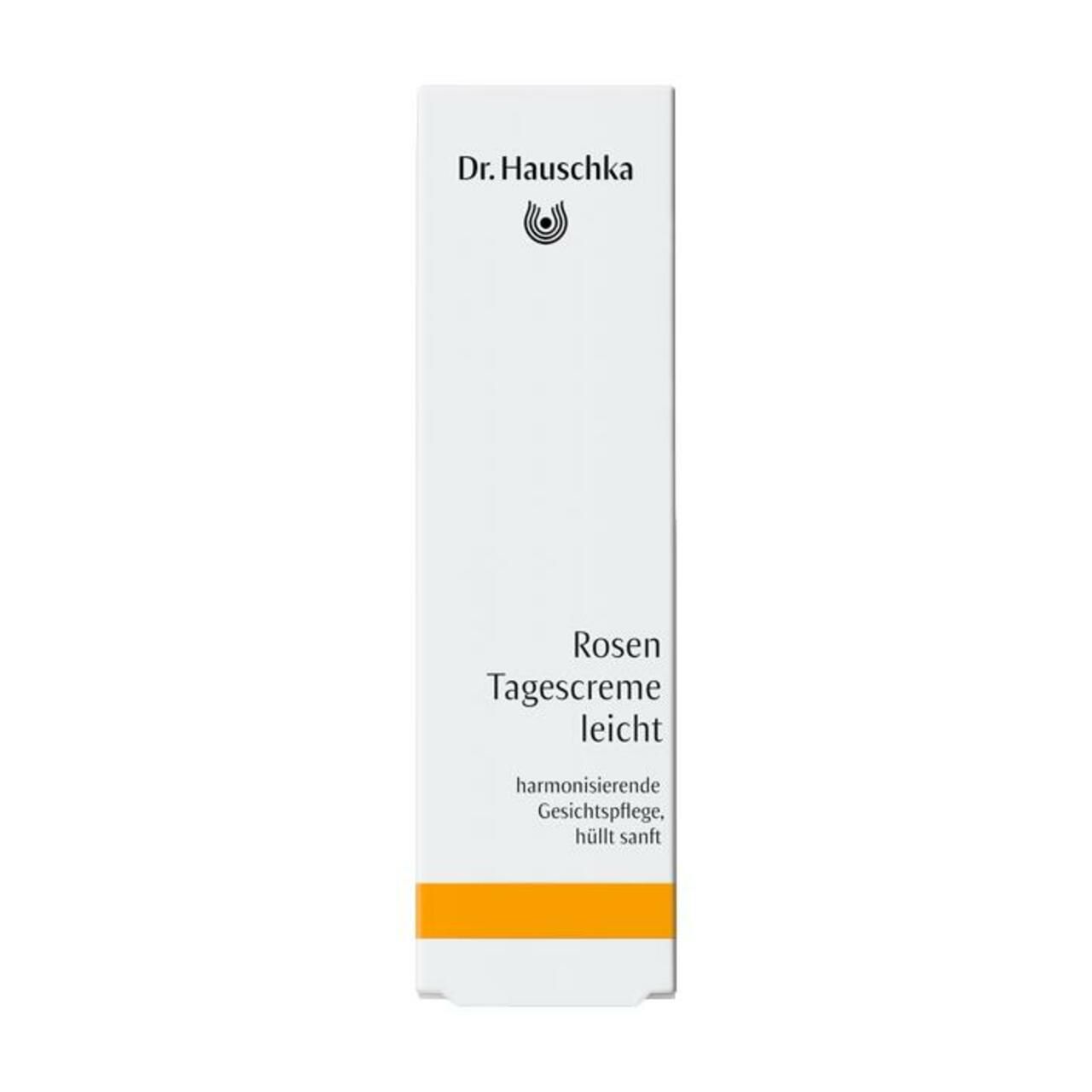 Weiße Verpackung mit Text. Dr. Hauschka Logo. Rosen Tagescreme leicht. Orangefarbener Streifen.