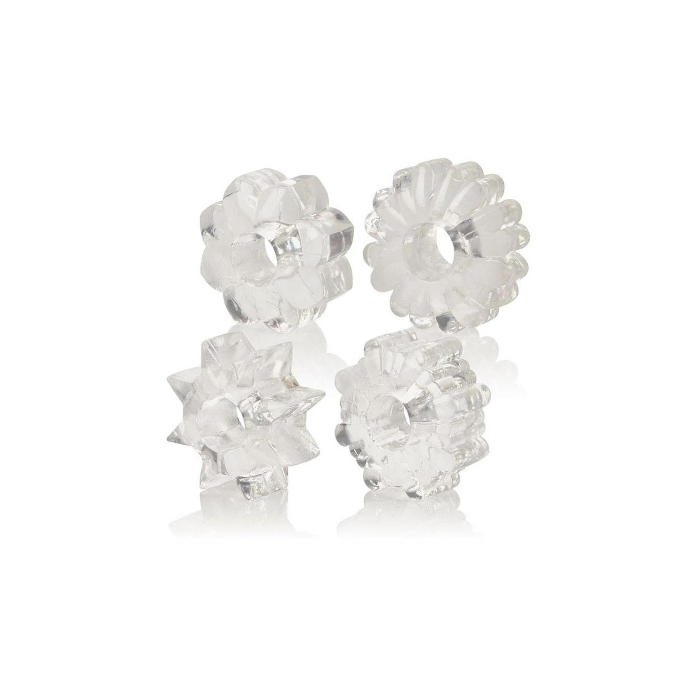 Vier durchsichtige, blütenförmige Ringe. Unterschiedliche Designs mit zentraler Öffnung.