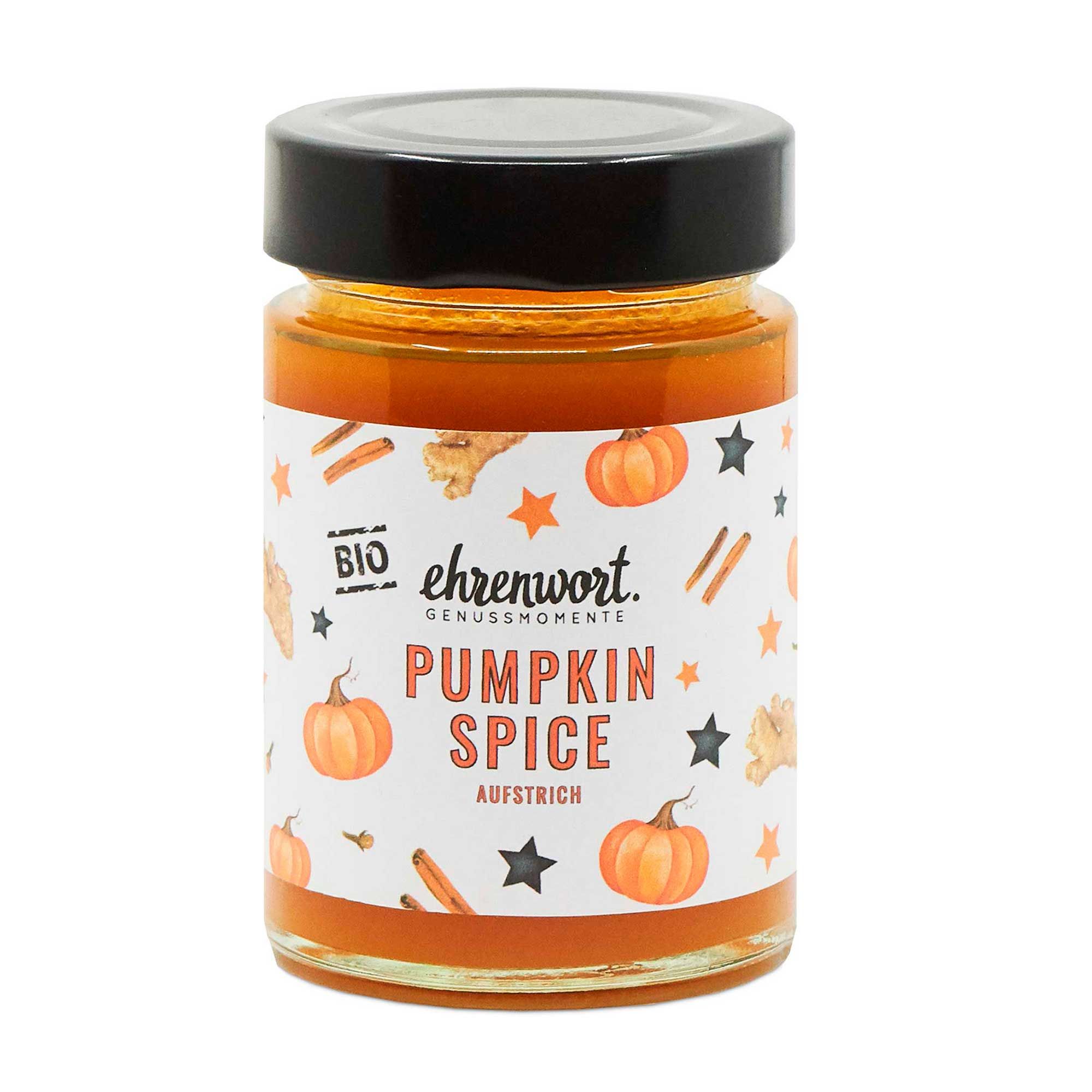 Glas mit orangefarbenem Aufstrich, schwarzem Deckel und Etikett. Aufschrift: Pumpkin Spice Aufstrich. Mit Kürbis- und Sternmotiven.
