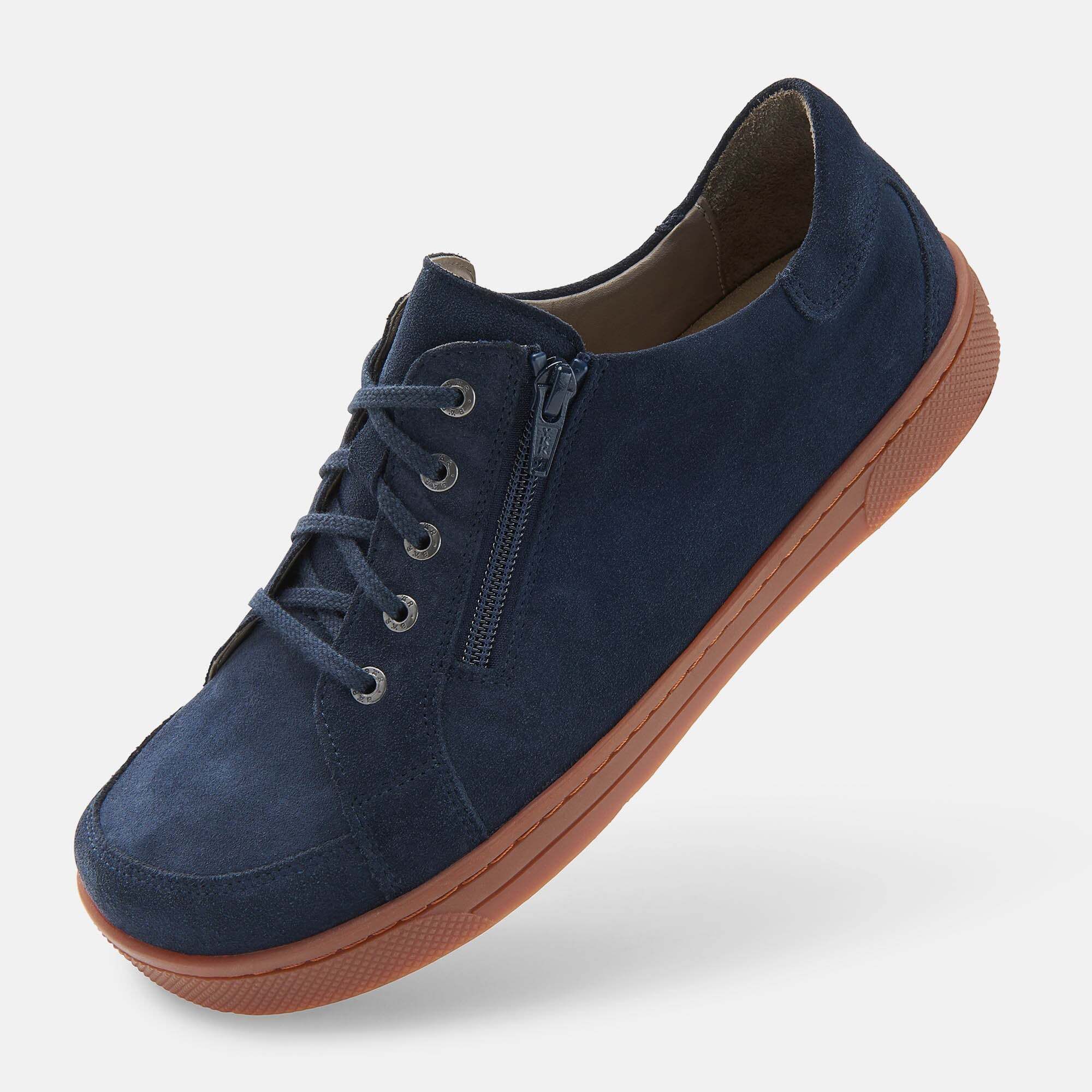 Dunkelblaue Wildleder-Sneaker mit Schnürung und seitlichem Reißverschluss.