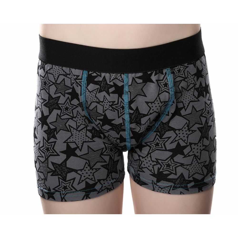 Graue Inkontinenz-Shorts mit Sternenmuster. Schwarzer Bund, blaue Nähte. Kurze Form.