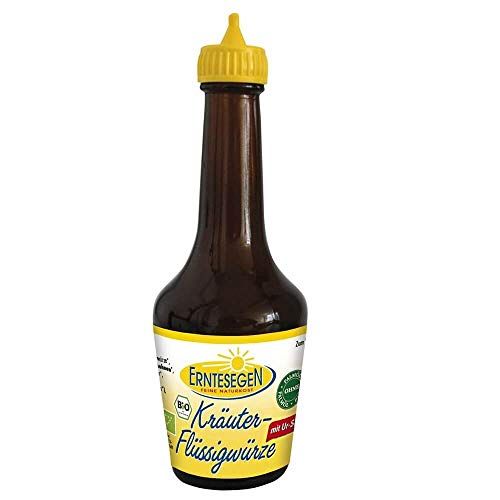 Braune Glasflasche mit gelbem Tropfverschluss, gefüllt mit Kräuter-Flüssigwürze. Etikett mit Bio-Siegel und Produktnamen.