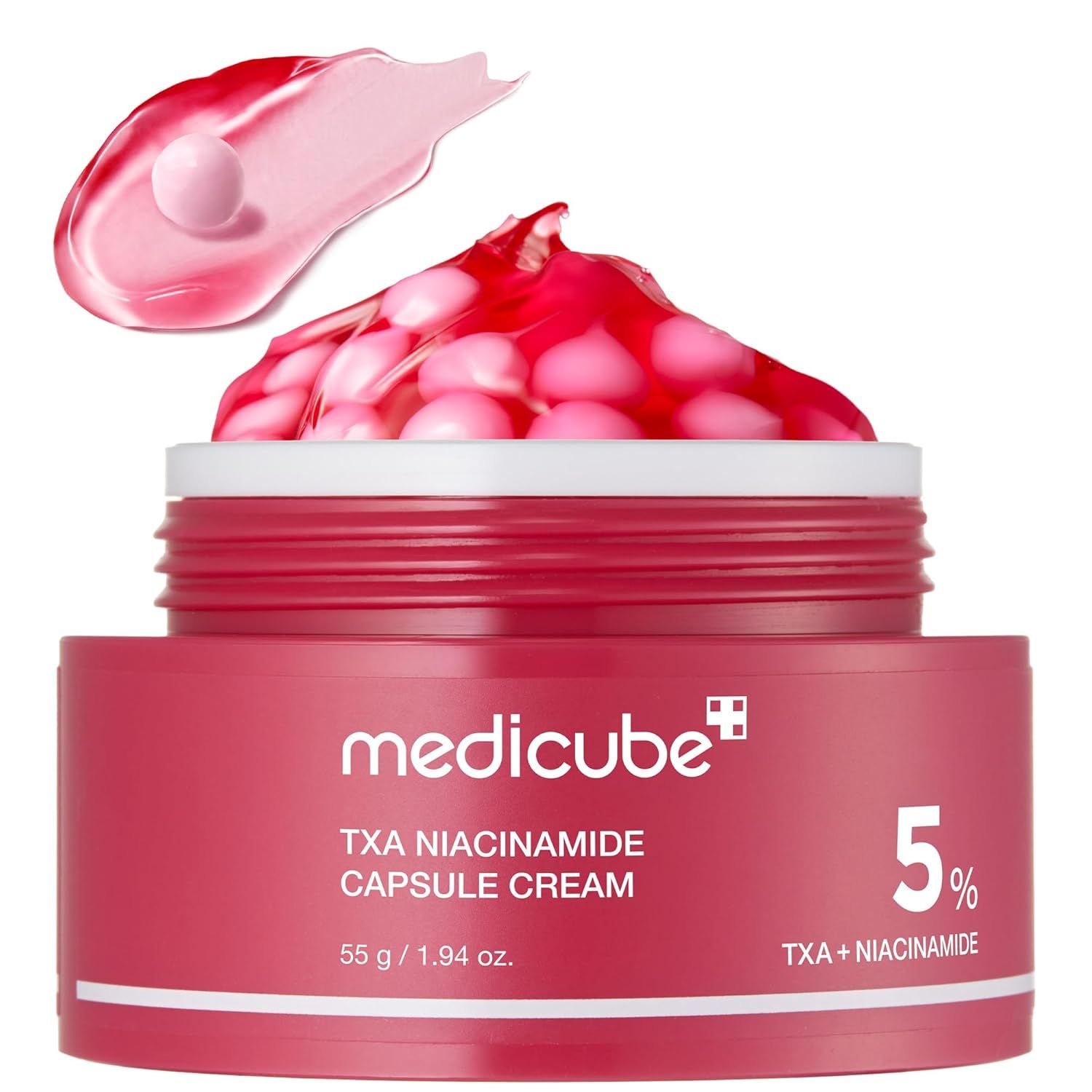 Rote Creme in einem Tiegel. Obenauf Creme mit rosa Kapseln. Aufschrift: medicube, TXA Niacinamide Capsule Cream, 5%.