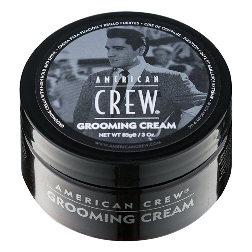 Schwarze Dose American Crew Grooming Cream. Deckel mit Bild und Text. Produktname und Marke auf dem Behälter.