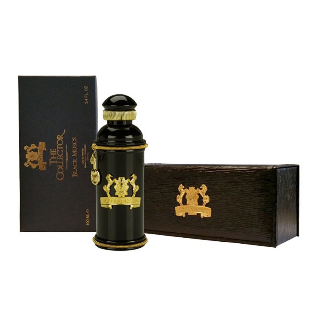 Schwarze Flasche mit goldfarbenen Verzierungen, neben einer schwarzen Schachtel und einer Holzbox.