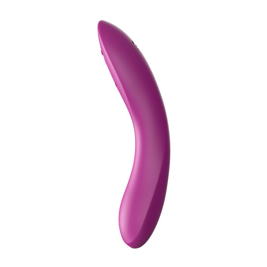 Gebogener, pinkfarbener Vibrator. Glatte Oberfläche. Ansicht von der Seite.