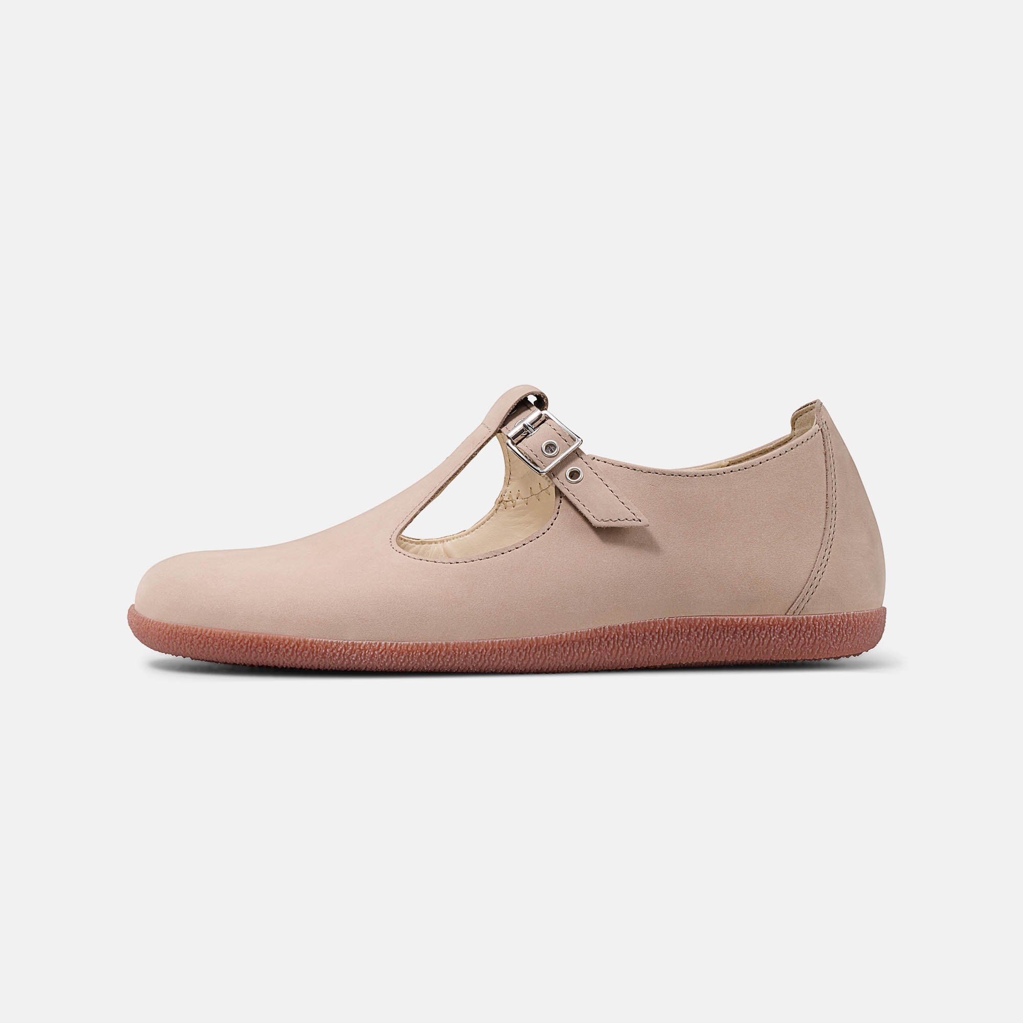 Beigefarbener Damen-Slipper mit T-Riemen und Schnallenverschluss. Rote Sohle. Seitenansicht.