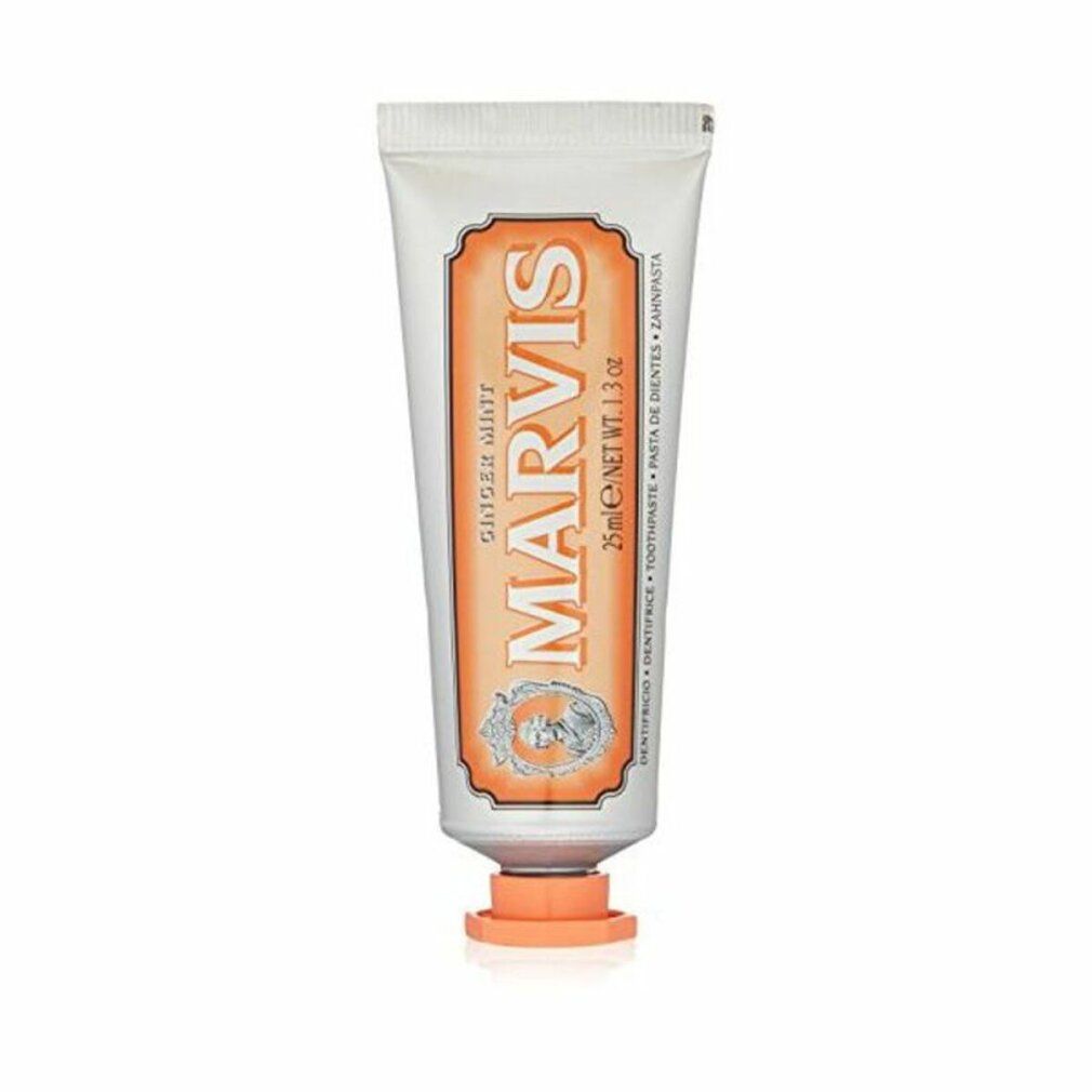 Zahnpasta-Tube. Silberfarben, orangefarbene Akzente. Aufschrift: MARVIS Ginger Mint. 25ml/1.3 oz.