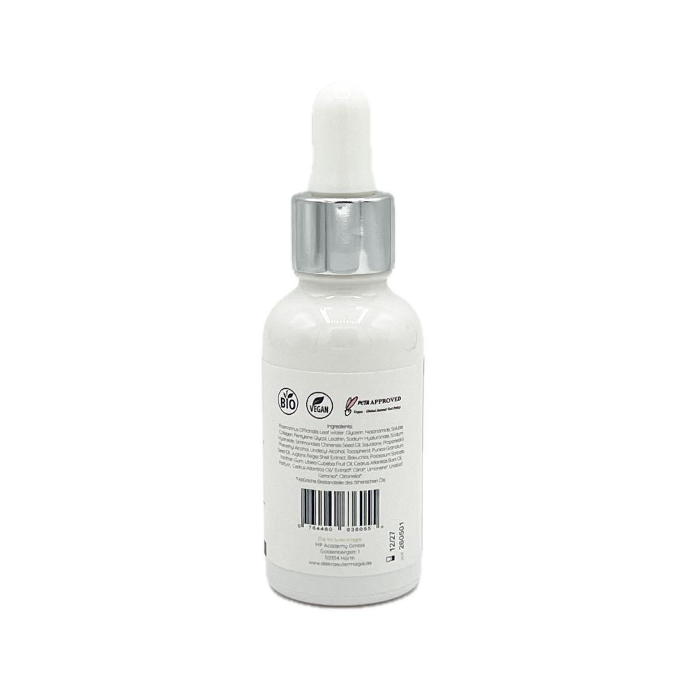 Rückseite der Serumflasche. Text über Inhaltsstoffe und Zertifizierungen. Logo: Die Kräutermagie. Mit Pipette.