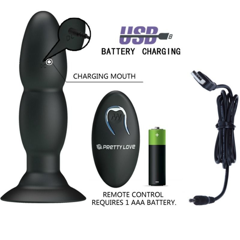 Schwarzer Plug-Vibrator, Fernbedienung, Batterie und Ladekabel. Beschriftung: USB Battery Charging.