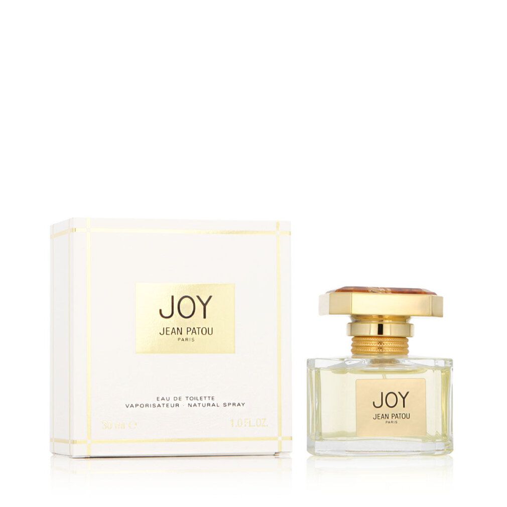 Parfümflakon und Verpackung. Flakon mit goldfarbenem Verschluss und Etikett "JOY JEAN PATOU PARIS". Verpackung mit Logo.