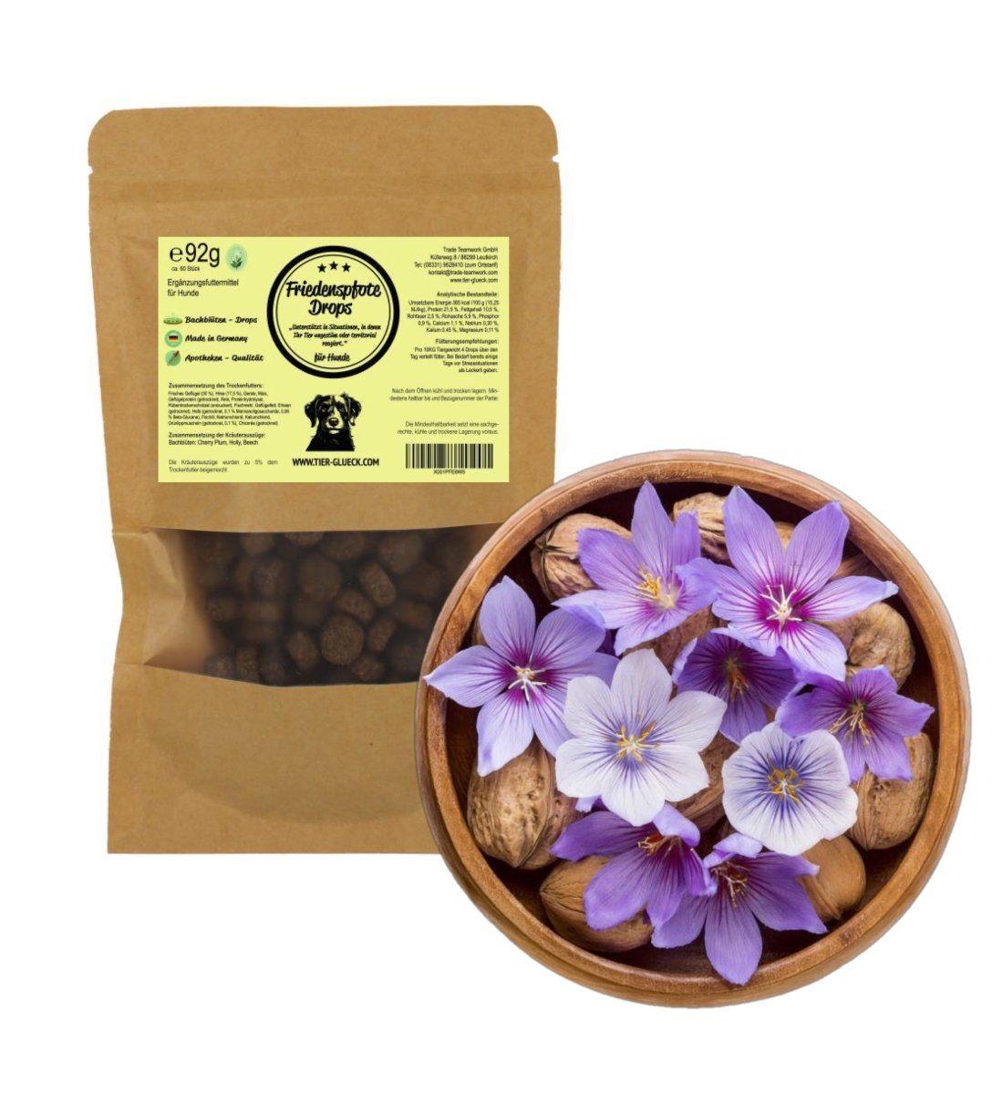 Braune Tüte mit Futterdrops für Hunde. Aufdruck: Friedenspfote Drops, Bachblüten, 92g. Daneben eine Schale mit Blüten und Nüssen.
