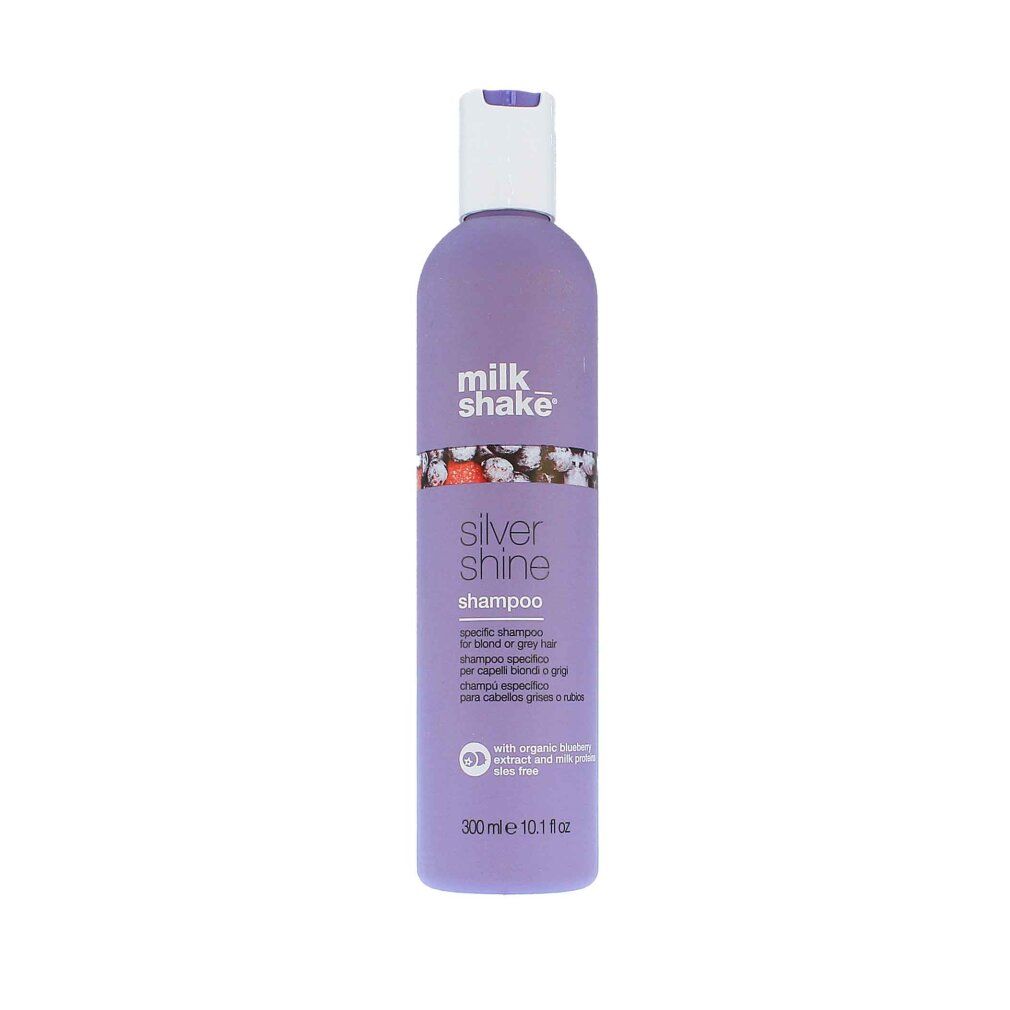 Lila Shampoo-Flasche mit weißem Deckel. Aufschrift: milk_shake, Silver Shine Shampoo. Mehrsprachiger Text.