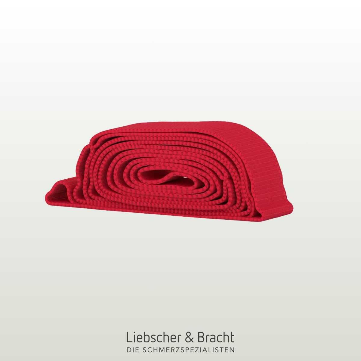Gerollte rote Übungsschlaufe auf hellem Hintergrund.