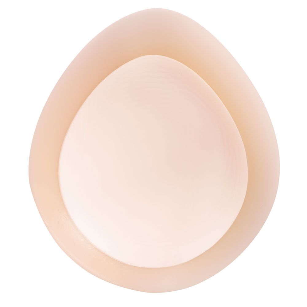Ausgleichsepithese, oval, hautfarben. Innenliegende Aussparung. Für Brustausgleich.