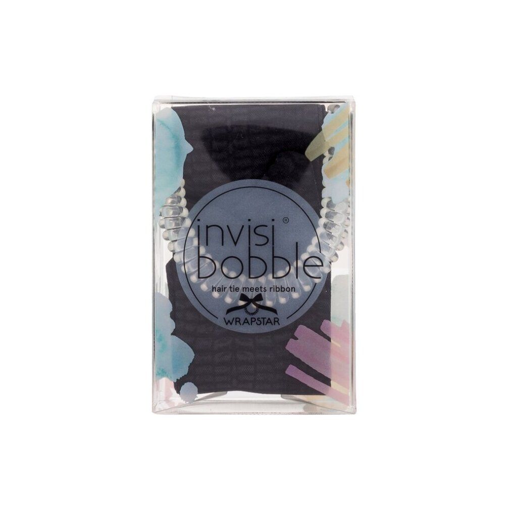 Haargummi in transparenter Verpackung. Sichtbar: schwarzes Haargummi, Markenlogo und Schriftzug.