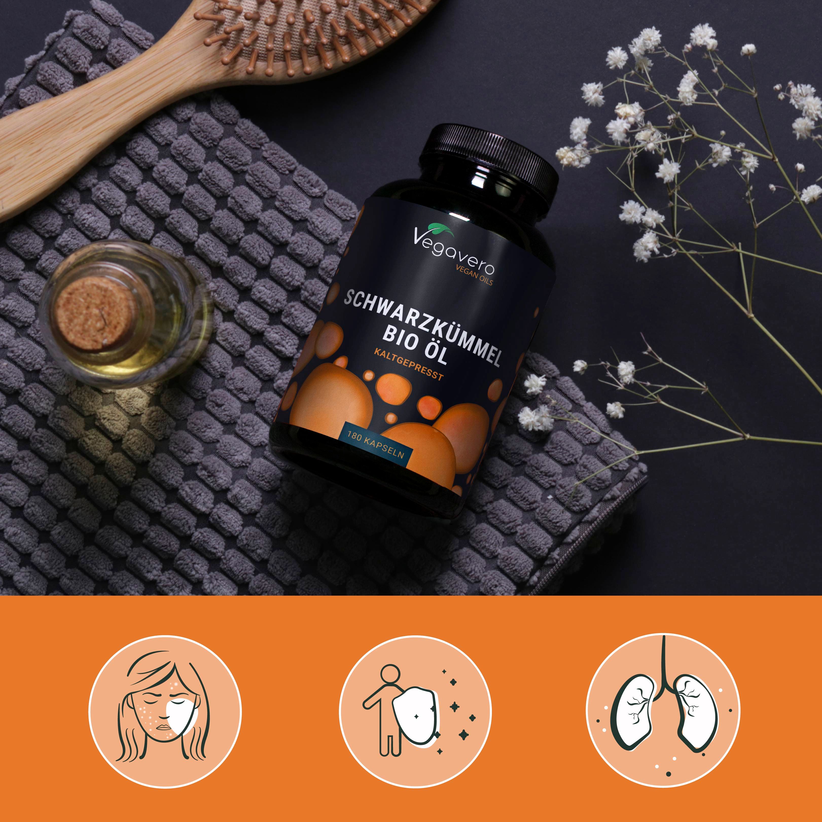 Produkt mit Zubehör. Flasche mit Schwarzkümmelöl, Bürste, Blüten. Gesicht, Immunsystem, Lunge.