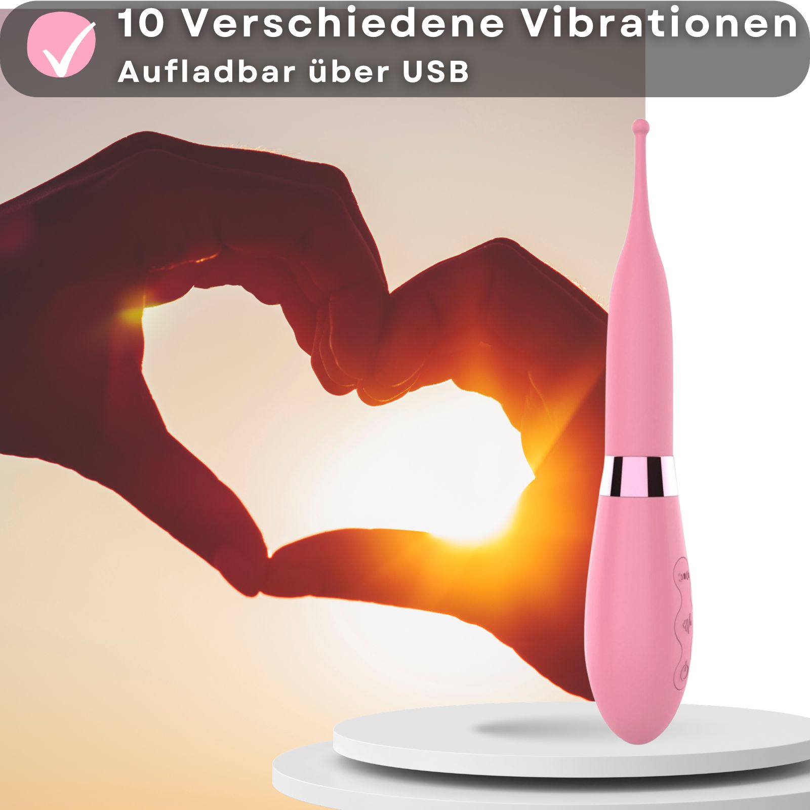 Rosa Vibrator mit Reizkugel. Aus Silikon und ABS. Hände formen Herz. Produkt auf weißem Podest. 10 Vibrationsmodi. USB.